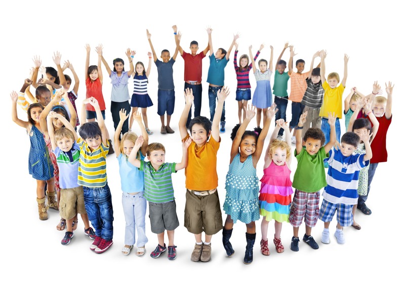 Young children standing in a circle and raising their arms above their heads.